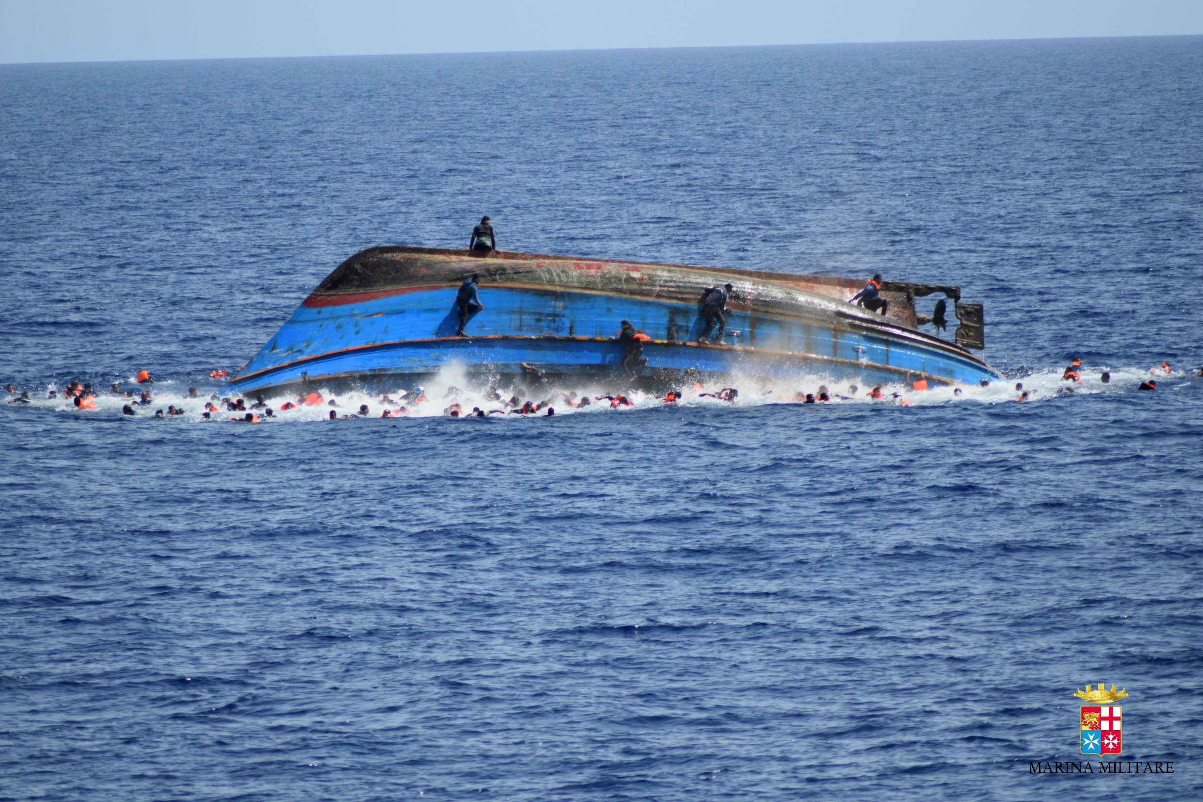 PHOTO: A handout picture from the Italian Navy shows the shipwreck of an overcrowded boat of migrants off the Libyan coast, May 25, 2016.