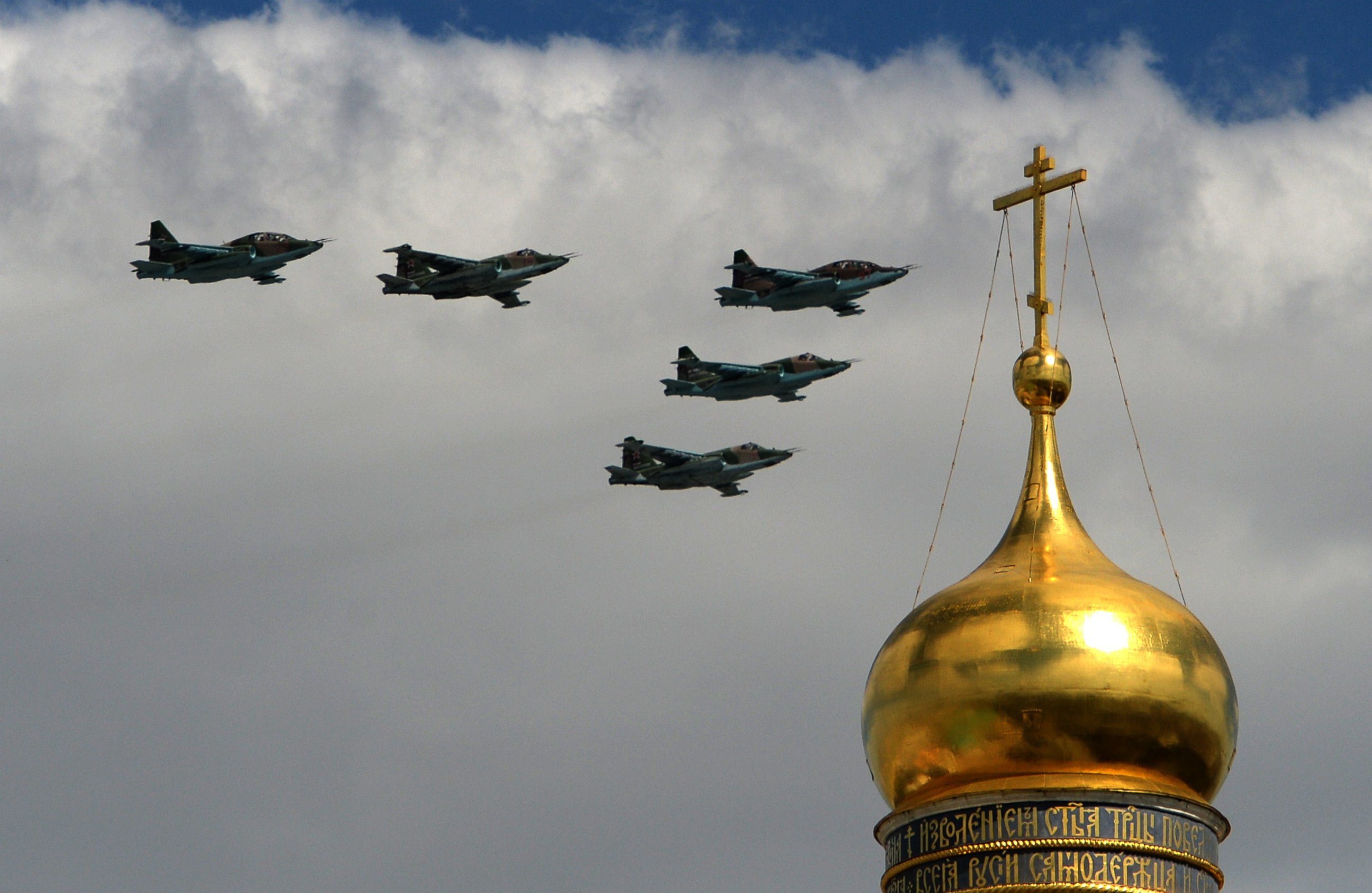 PHOTO: Russian Su-25 assault aircraft fly above the Kremlin's cathedrals in Moscow, on May 5, 2015, during a rehearsal of the Victory Day parade.