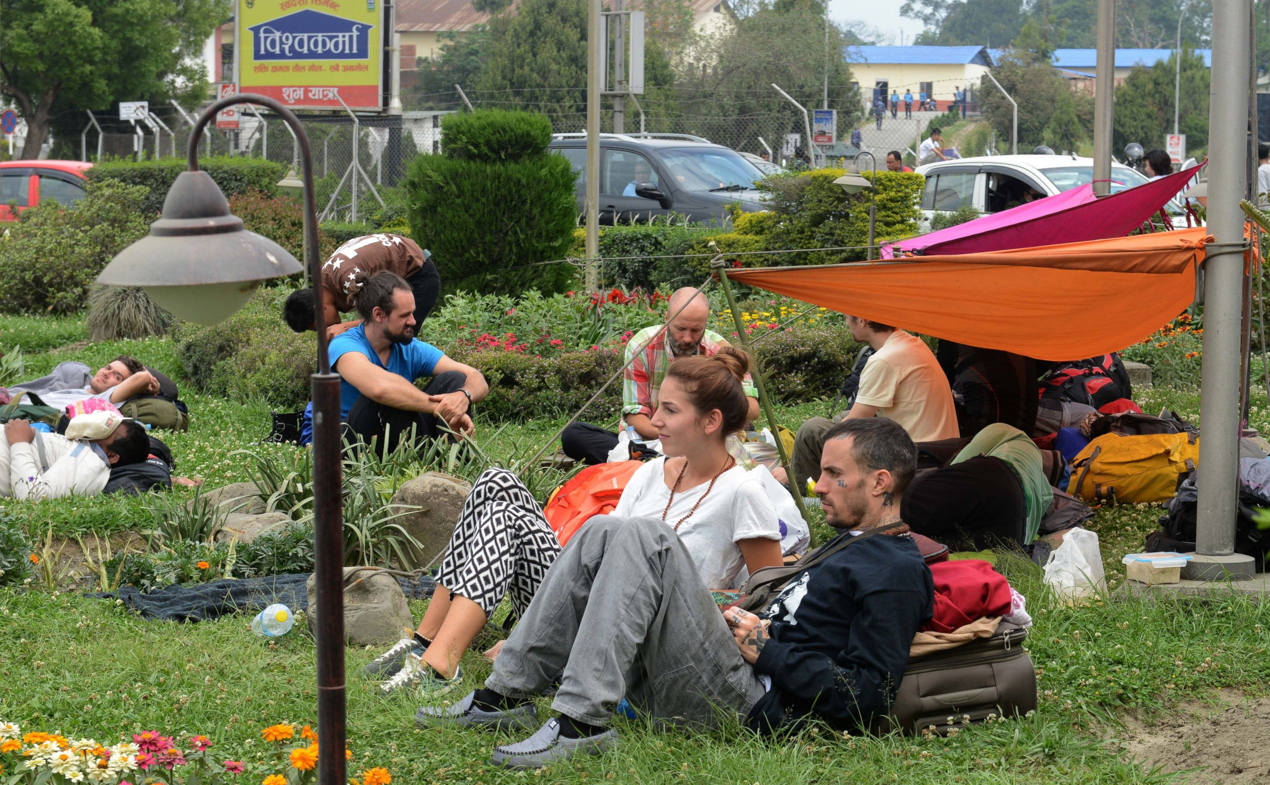 PHOTO: Tourists wait outside Kathmandu airport following an earthquake in the Nepalese capital Kathmandu on April 26, 2015.