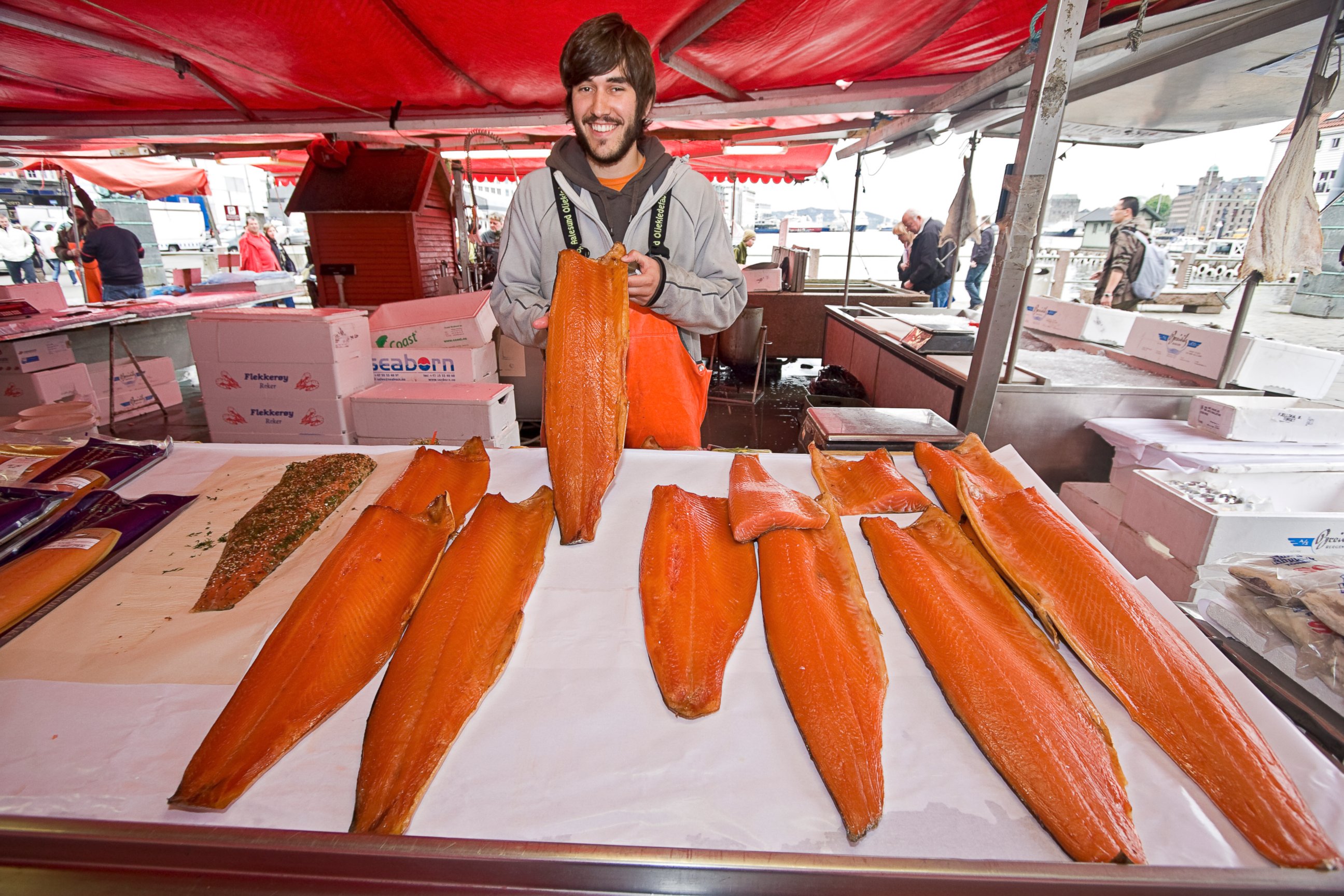 PHOTO: A man offers salmon for sale at the waterfront fish market in Bergen, Norway.