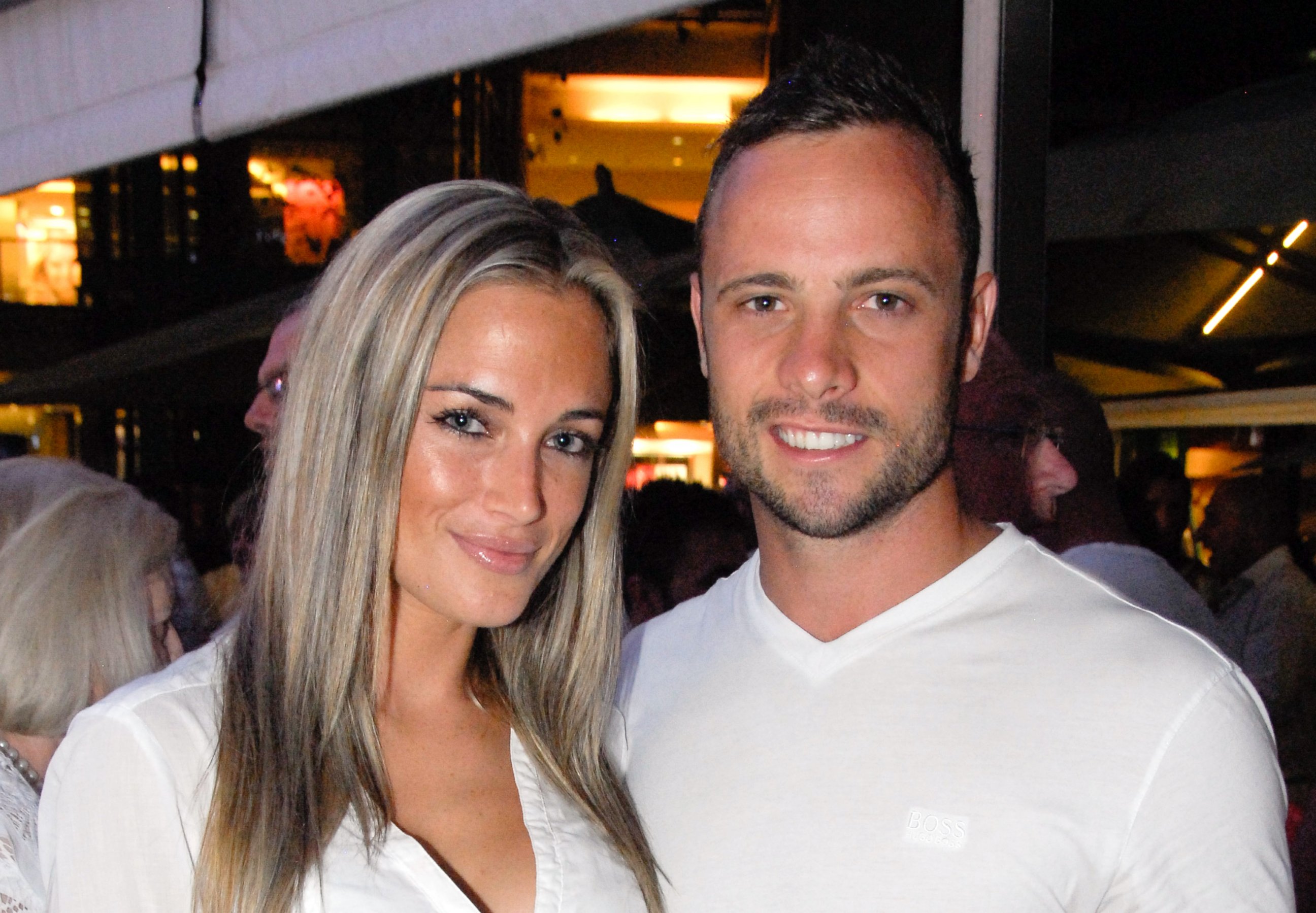 PHOTO: A picture taken on Jan. 26, 2013 shows Olympian sprinter Oscar Pistorius posing next to his girlfriend  Reeva Steenkamp at Melrose Arch in Johannesburg. 