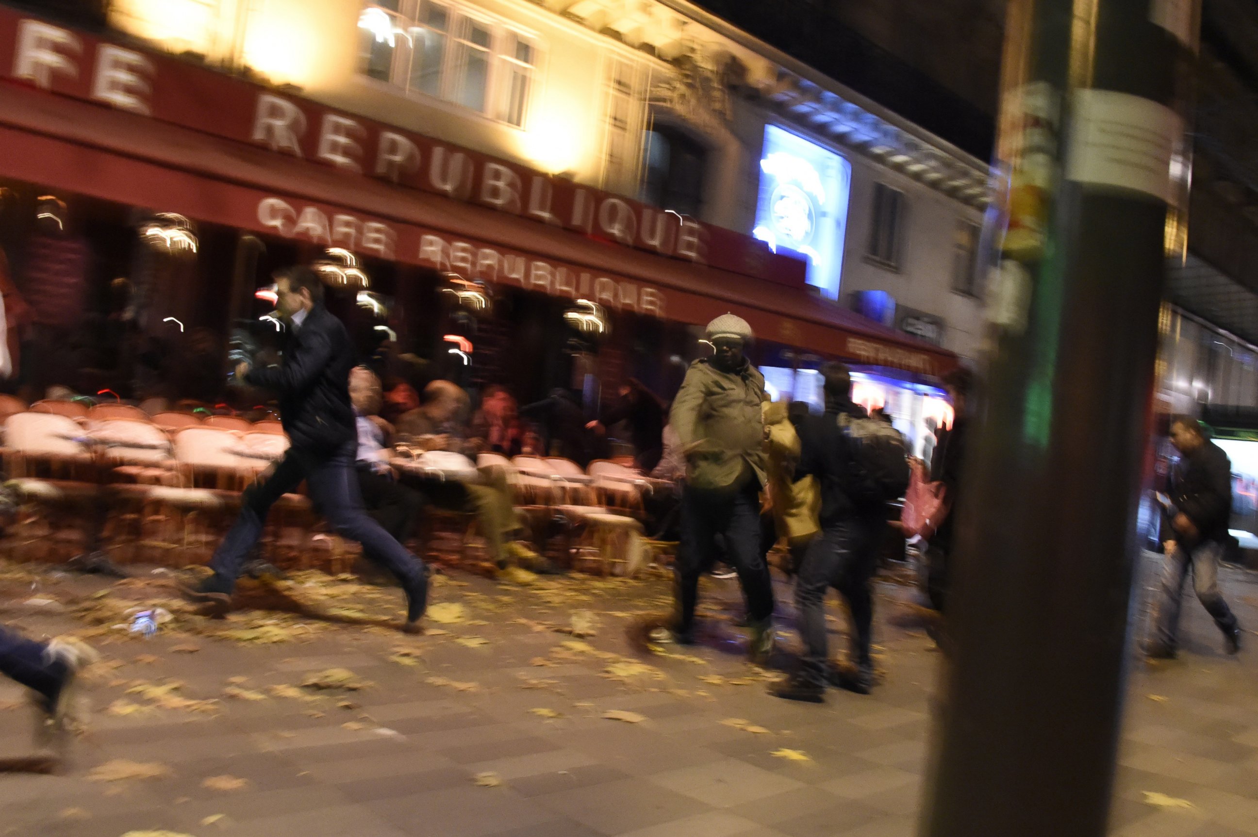 PHOTO: People run after hearing what is believed to be explosions or gun shots near Place de la Republique square in Paris on Nov. 13, 2015.