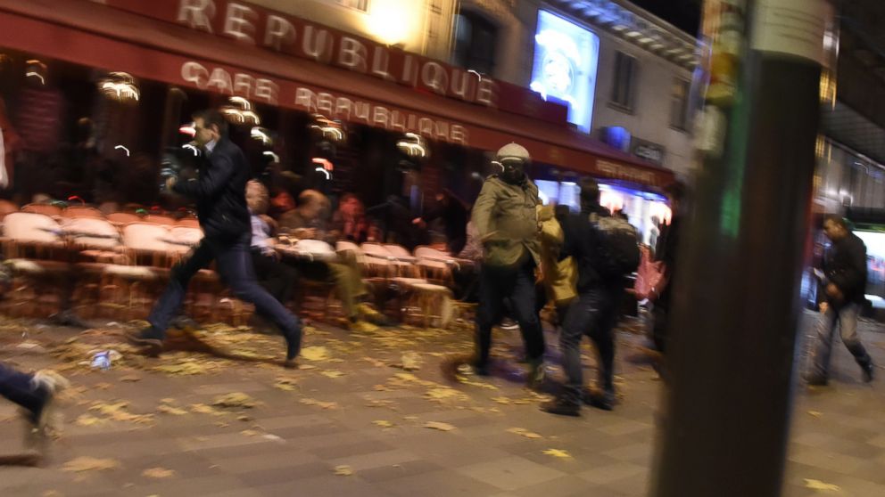 PHOTO: People run after hearing what is believed to be explosions or gun shots near Place de la Republique square in Paris on Nov. 13, 2015.