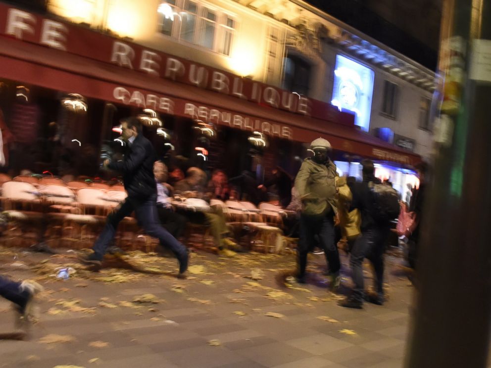 PHOTO: People run after hearing what is believed to be explosions or gun shots near Place de la Republique square in Paris on Nov. 13, 2015.