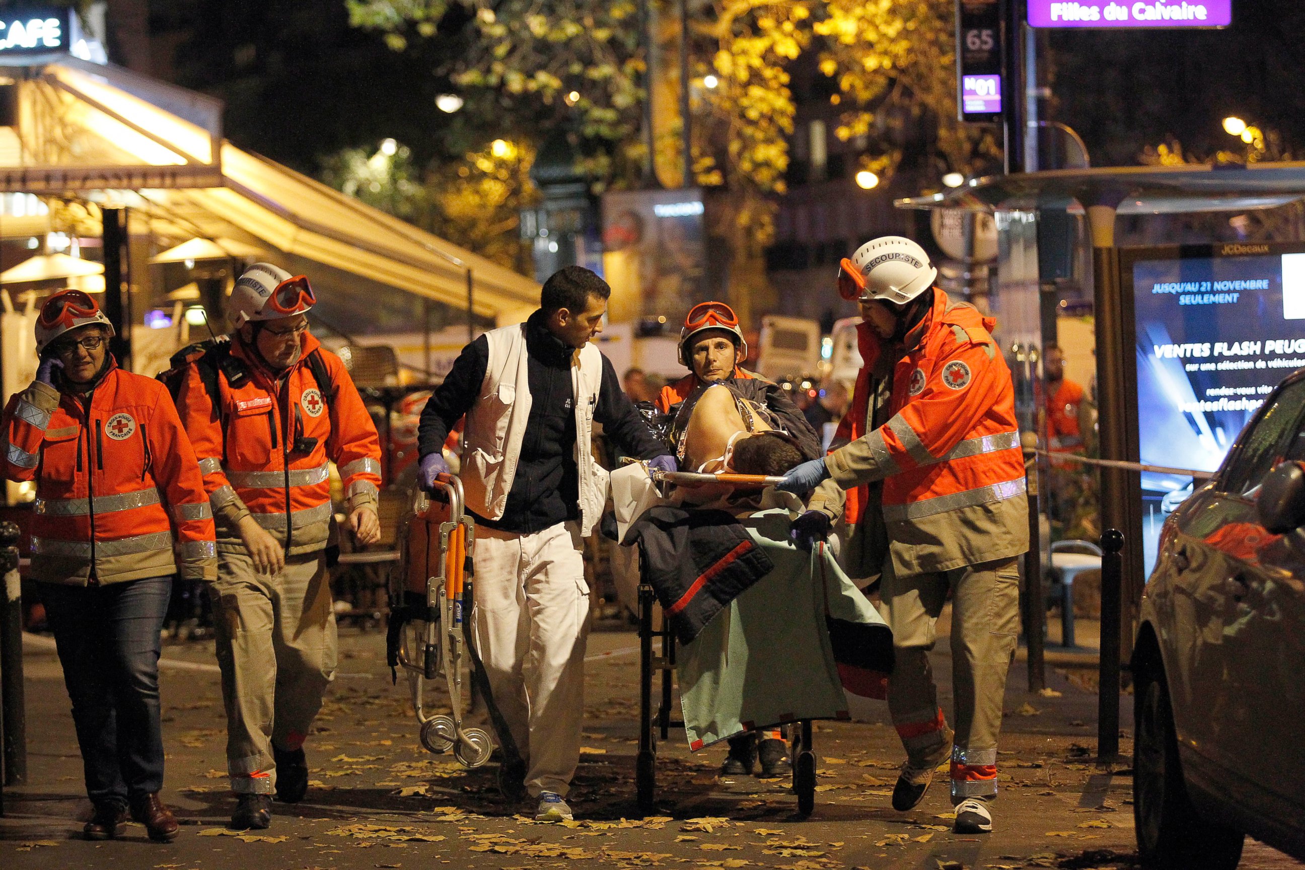 PHOTO: Medics evacuate an injured person on Boulevard des Filles du Calvaire, close to the Bataclan theater, early on Nov. 14, 2015 in Paris.  