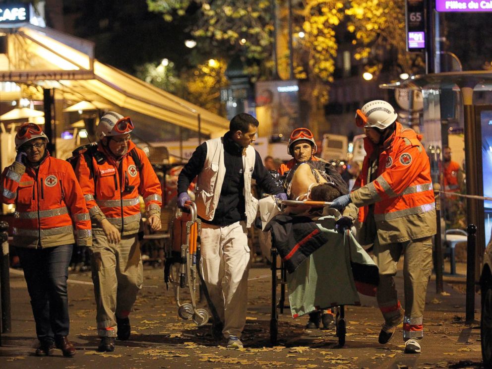 PHOTO: Medics evacuate an injured person on Boulevard des Filles du Calvaire, close to the Bataclan theater, early on Nov. 14, 2015 in Paris.