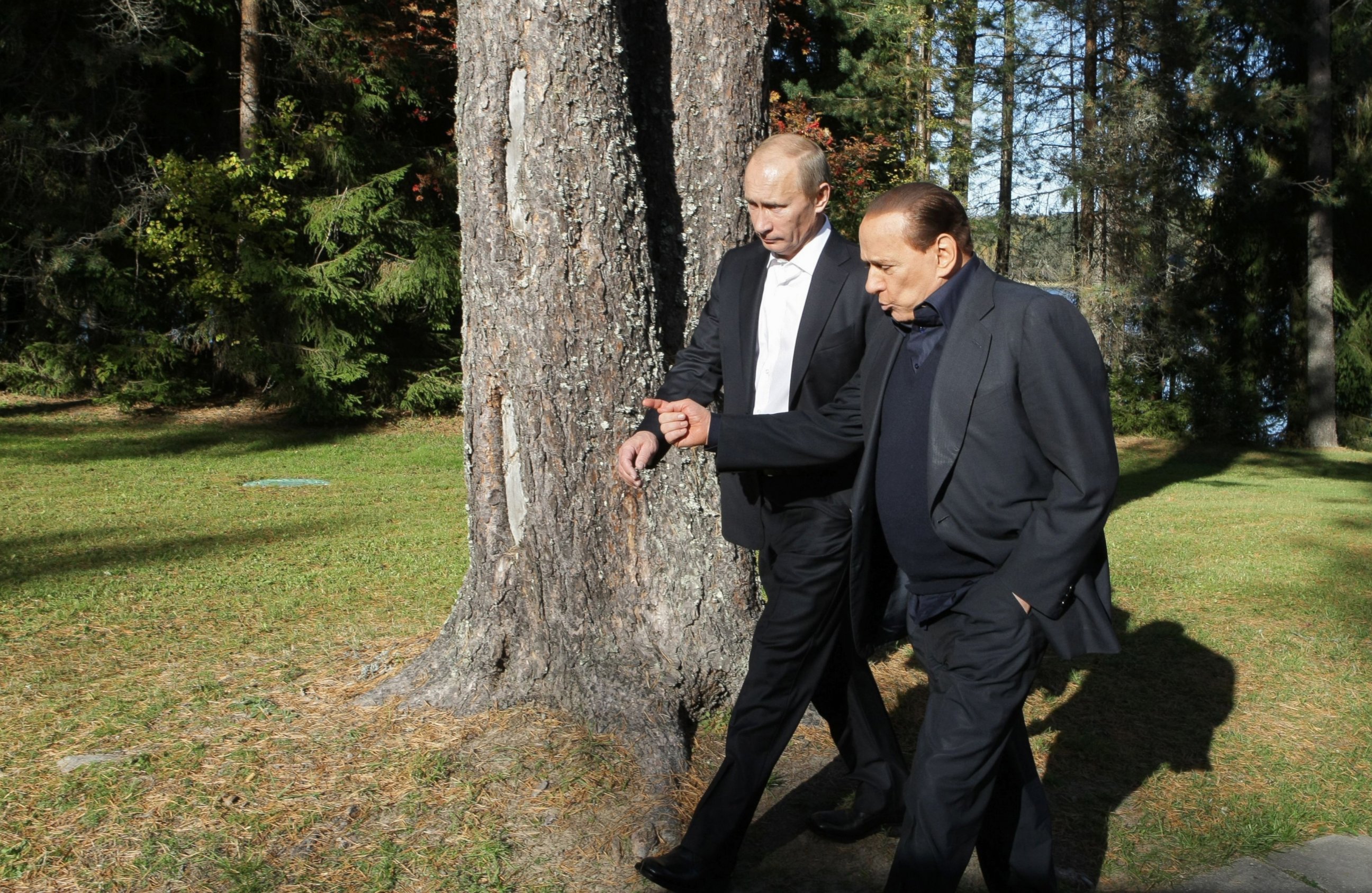 PHOTO: Russian Prime Minister Vladimir Putin (L) walks with his Italian counterpart Silvio Berlusconi in Saint Petersburg on October 9, 2010.  