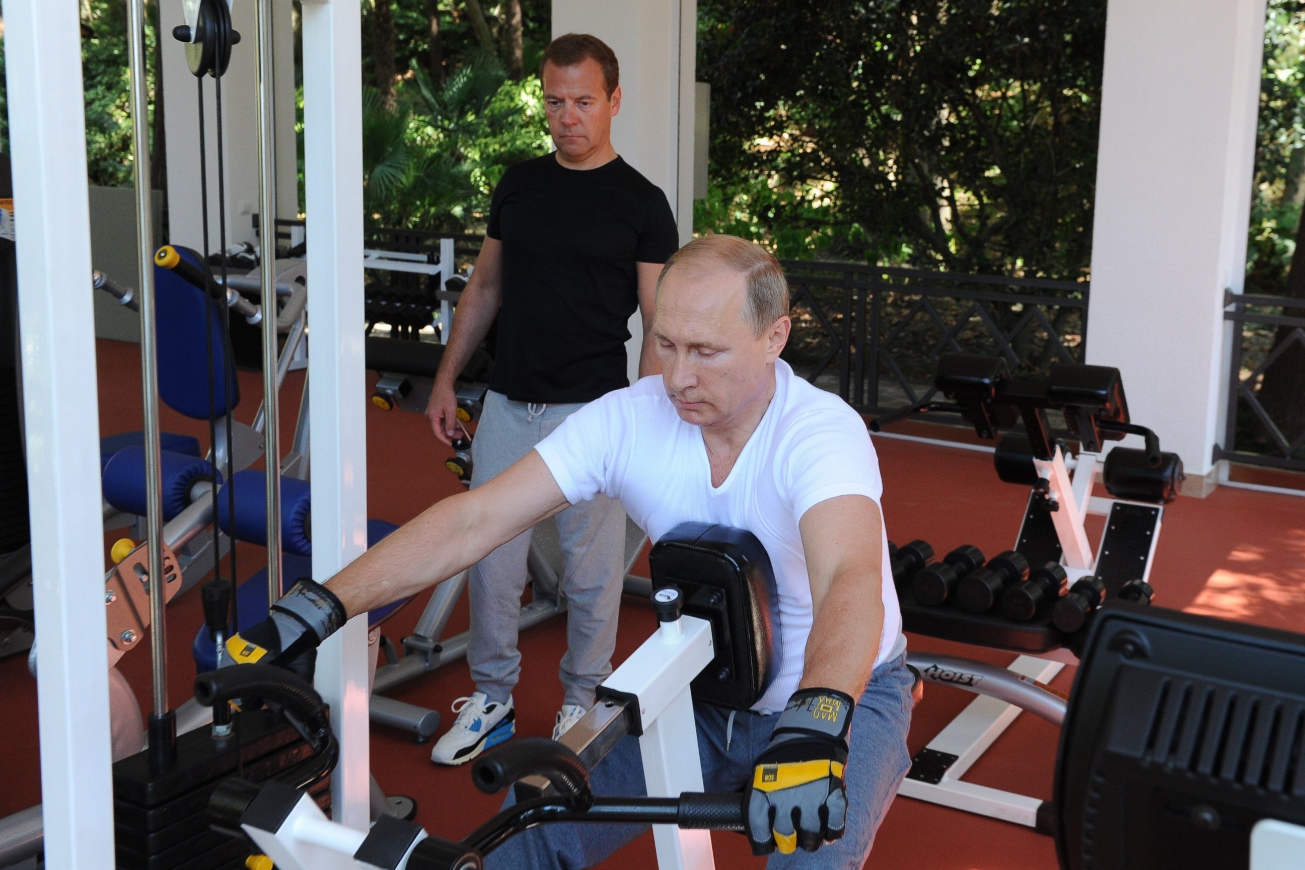 PHOTO: Russian President Vladimir Putin and Prime Minister Dmitry Medvedev work out at a gym at the Bocharov Ruchei state residence in Sochi on Aug. 30, 2015.