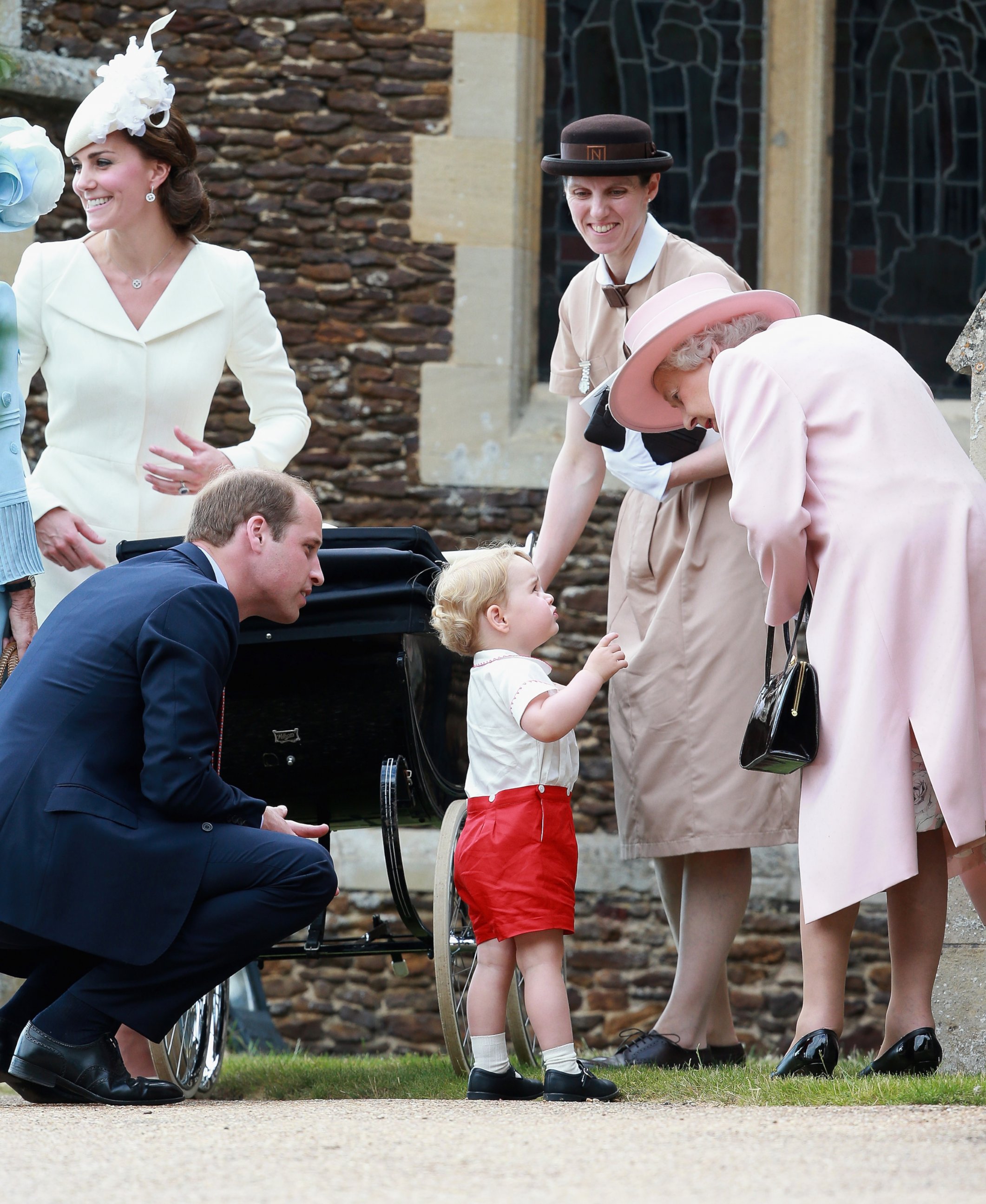 PHOTO: Catherine, Duchess of Cambridge, Prince William, Princess Charlotte and Prince George, Queen Elizabeth II and a nanny at the Church of St Mary Magdalene for the Christening of Princess Charlotte of Cambridge on in King's Lynn, England.