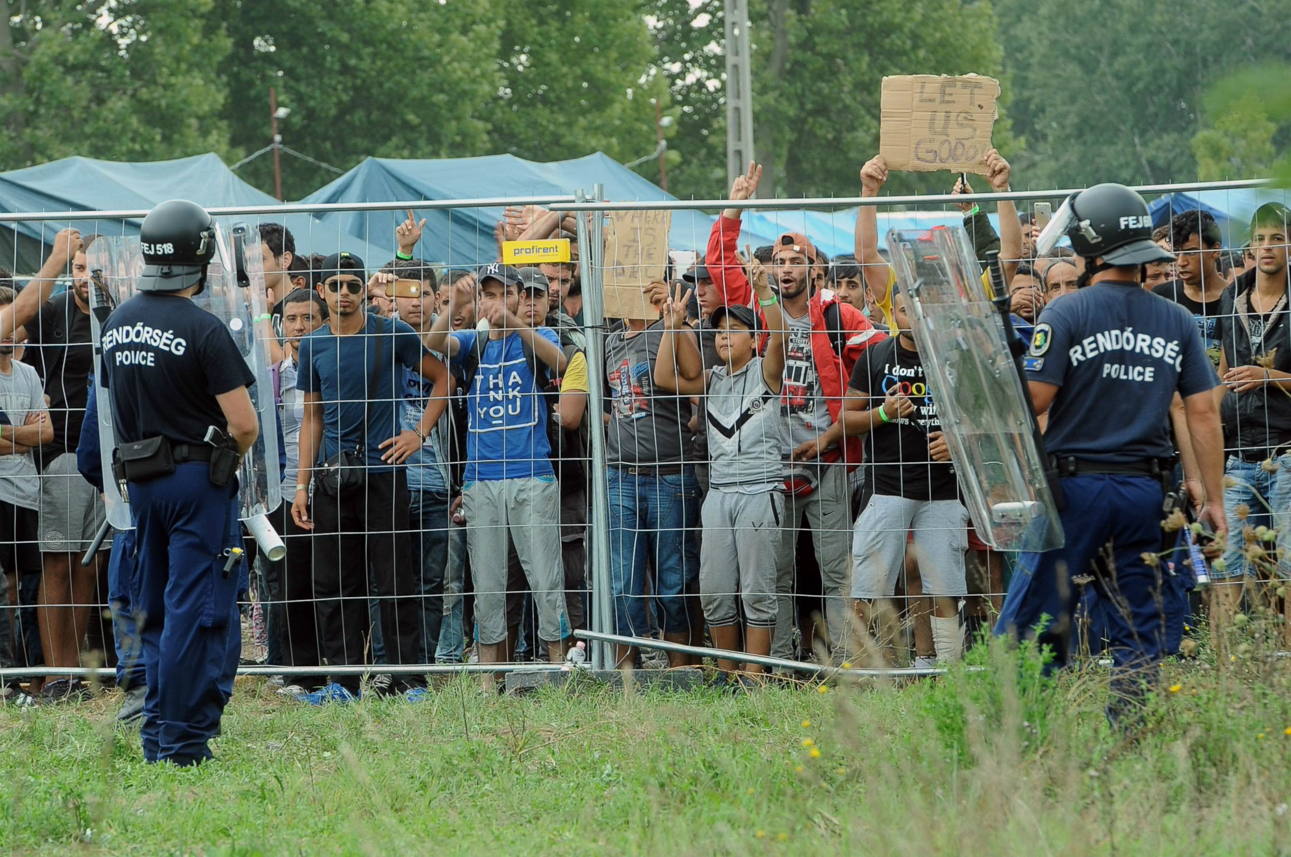 PHOTO: Police officers guard a refugee camp in the village of Roszke at the Serbian-Hungarian border on Sept. 4, 2015.
