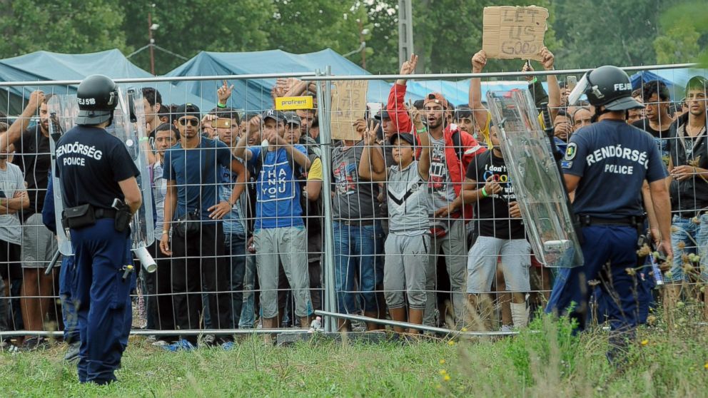 PHOTO: Police officers guard a refugee camp in the village of Roszke at the Serbian-Hungarian border on Sept. 4, 2015.