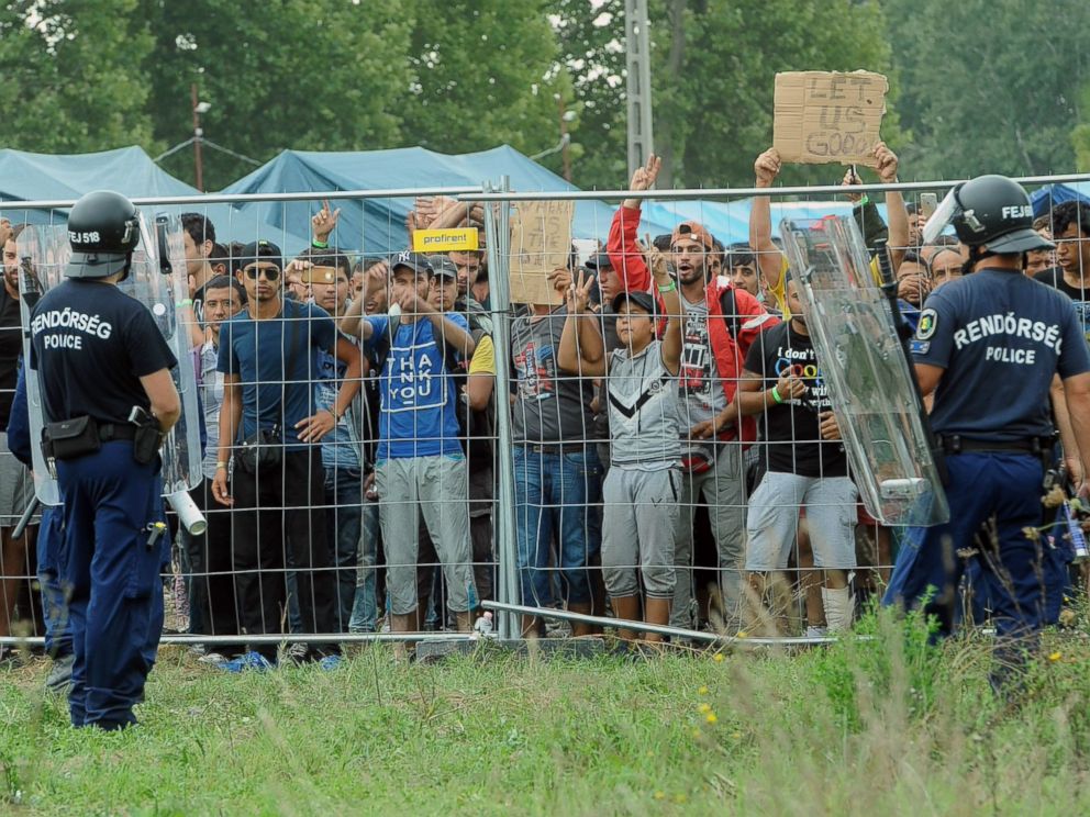 PHOTO: Police officers guard a refugee camp in the village of Roszke at the Serbian-Hungarian border on Sept. 4, 2015.