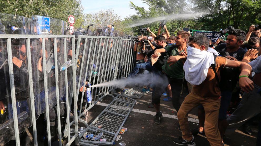 PHOTO: Hungarian police use pepper spray against refugees at the Horgos border after Hungarian authorities closed their border on Sept. 16, 2015 in Horgos, Serbia.