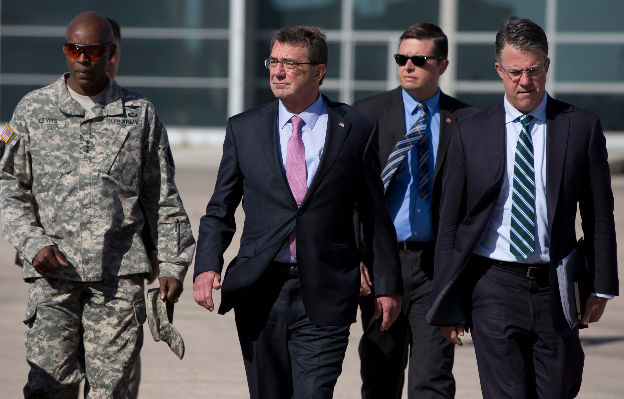 PHOTO: U.S. Defense Secretary Ash Carter, right, and U.S. Army Lt. Gen. Ron Lewis, left, walk on the tarmac before boarding a plane en route to Irbil, Iraq at Queen Alia Airport on July 24, 2015 in Amman, Jordan.