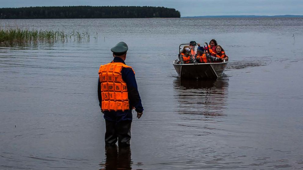 Emergency officers transport surviving children in a boat on Lake Syamozero in Russia's autonomic republic of Korelia, June 19, 2016.