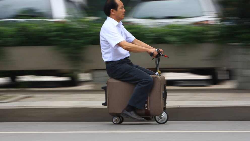 PHOTO: He Liangcai's motorized scooter suitcase can travel up to 12.5mph, rivaling your average motorized scooter.