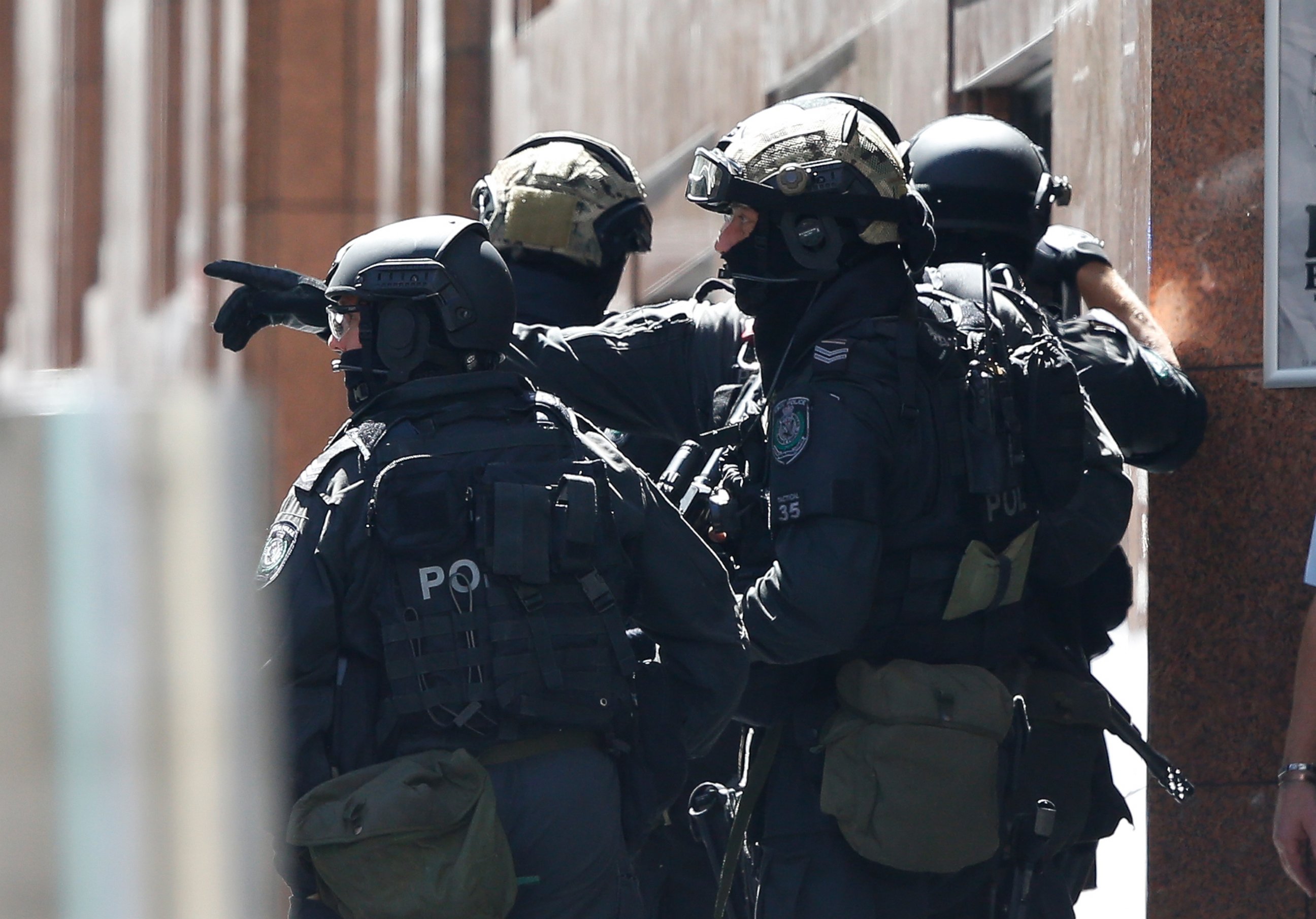 PHOTO: Police officers chat on the scene of the siege at Lindt Cafe in Martin Place on Dec. 15, 2014 in Sydney, Australia.  