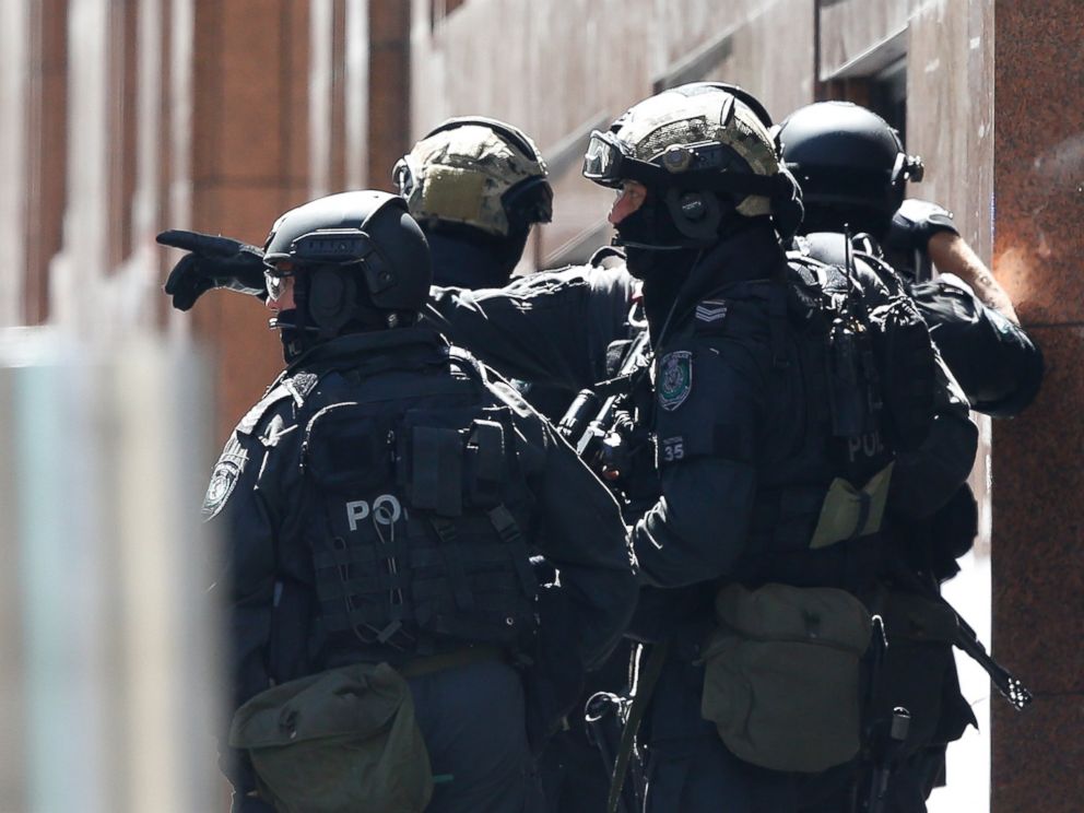 PHOTO: Police officers chat on the scene of the siege at Lindt Cafe in Martin Place on Dec. 15, 2014 in Sydney, Australia.