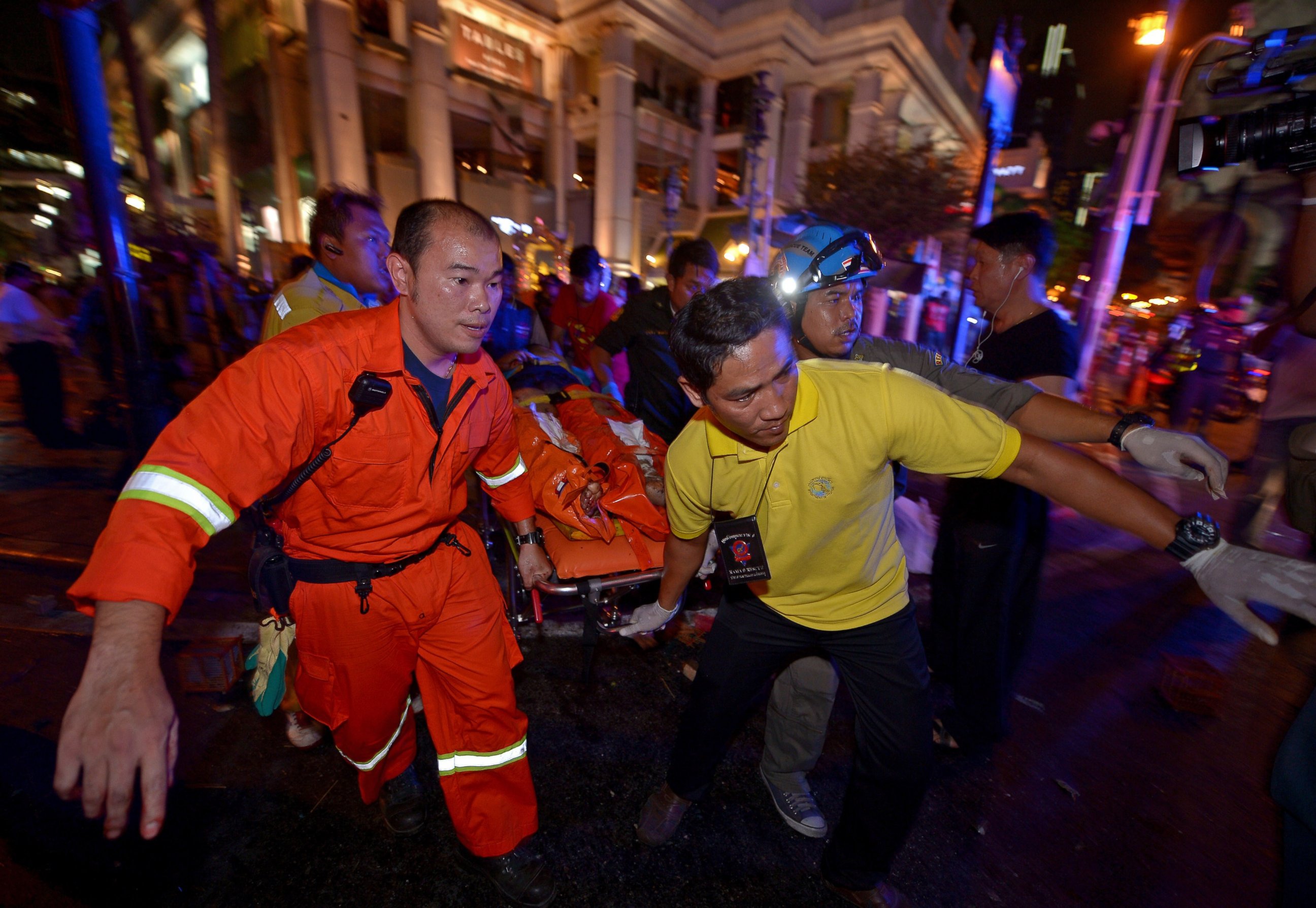 PHOTO: Thai rescue workers carry an injured person after a bomb exploded outside a religious shrine in central Bangkok late on Aug. 17, 2015.