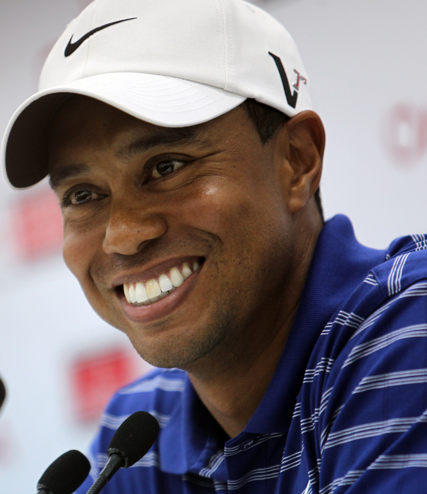 PHOTO: Tiger Woods smiles during a press conference prior to the start of the Dubai Desert Classic 2011 at the Emirates Golf Club on Feb. 9, 2011 in Dubai.