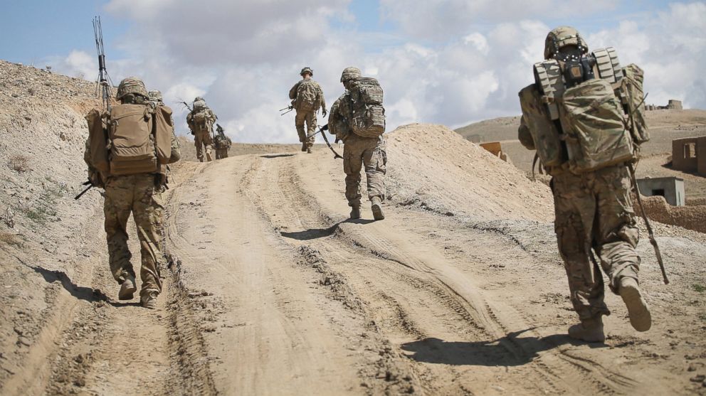 Soldiers with the U.S. Army's 2nd Battalion patrol on the edge of a village near Pul-e Alam, Afghanistan on March 29, 2014.