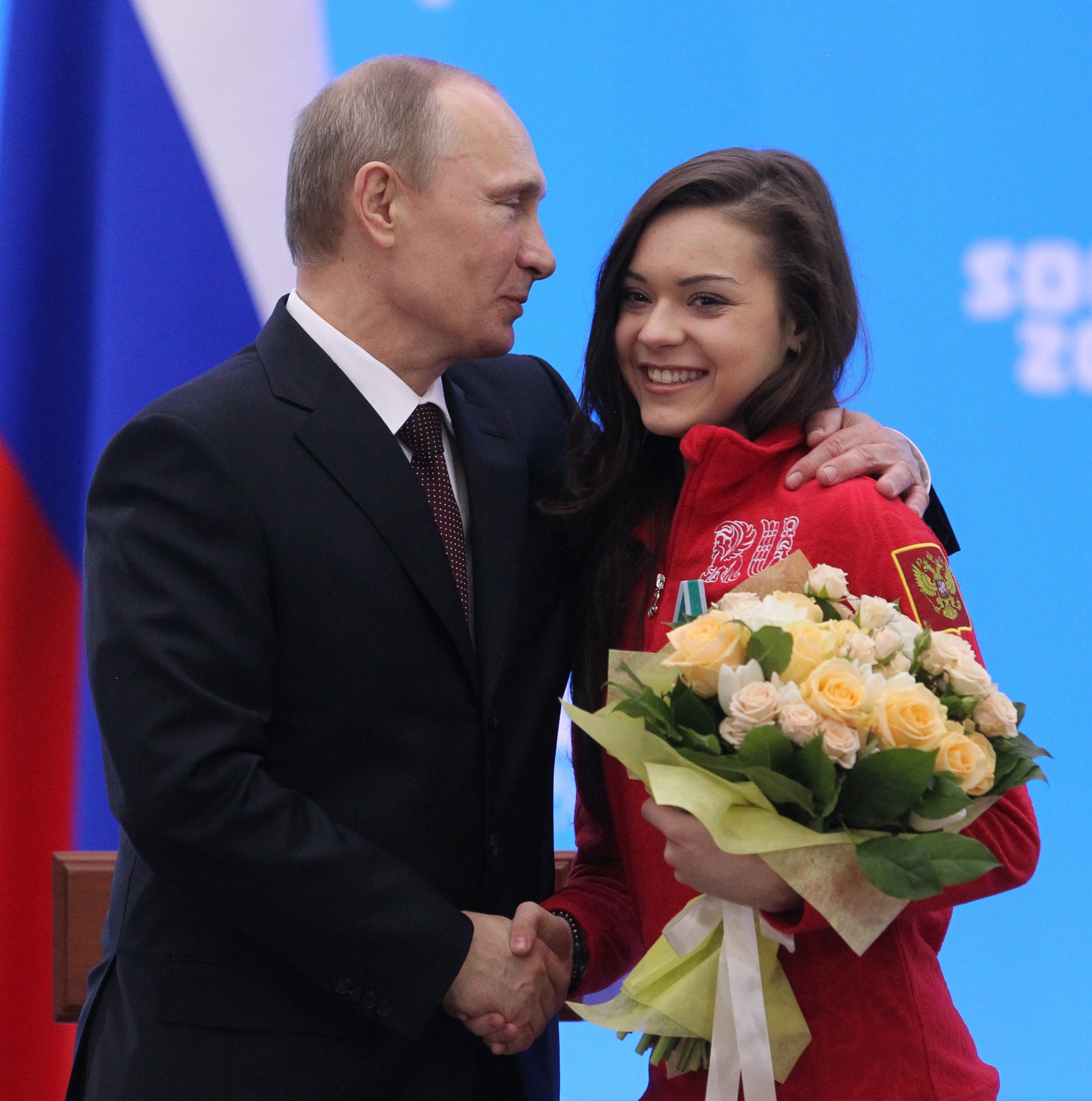 PHOTO: Russian President Vladimir Putin shakes hands with Olympic gold medalist in figure skating, Adelina Sotnikova, during an awards ceremony for Russian Olympic athletes on Feb. 24, 2014 in Sochi, Russia.