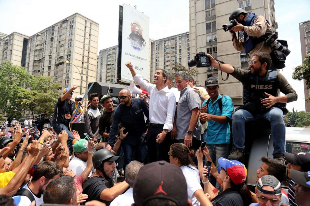 PHOTO: Venezuelan opposition leader Juan Guaido waves to his supporters during a demonstration in Caracas, May 1, 2019.