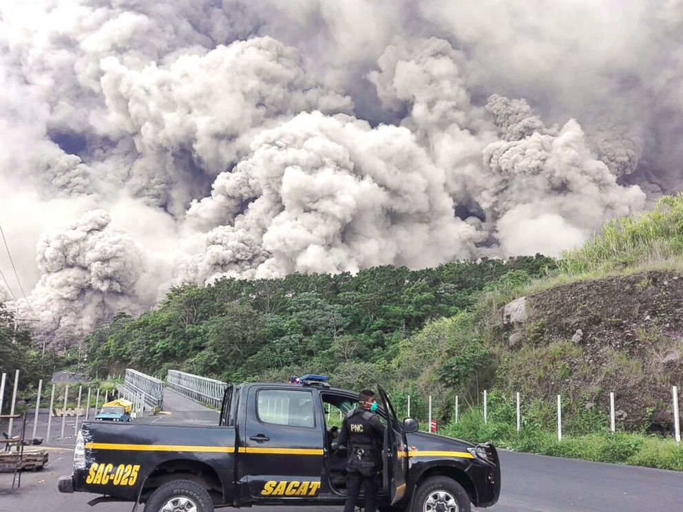 PHOTO: A policemen is pictured during search operations around Fuego volcano after an eruption in Guatemala, June 3, 2018.