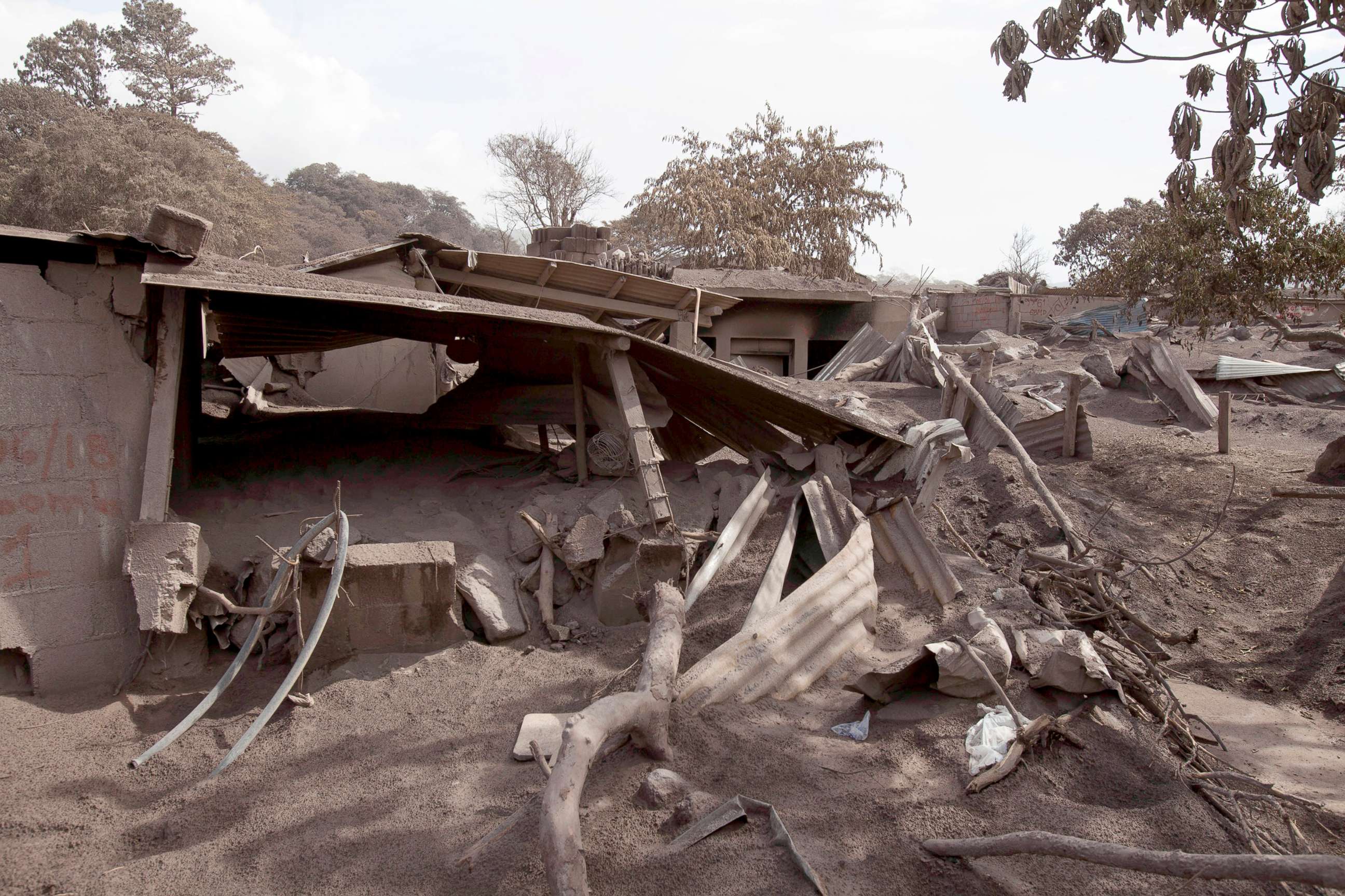 PHOTO: Volcanic ash blankets a home destroyed by the Volcan de Fuego, or "Volcano of Fire," eruption,  in Escuintla, Guatemala, June 6, 2018.