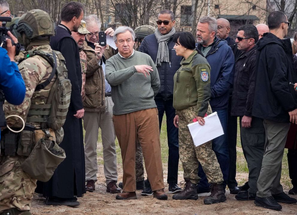 PHOTO: U.N. Secretary-General Antonio Guterres, center left, stands on the side of a mass grave in Bucha, on the outskirts of Kyiv, Ukraine, April 28, 2022.