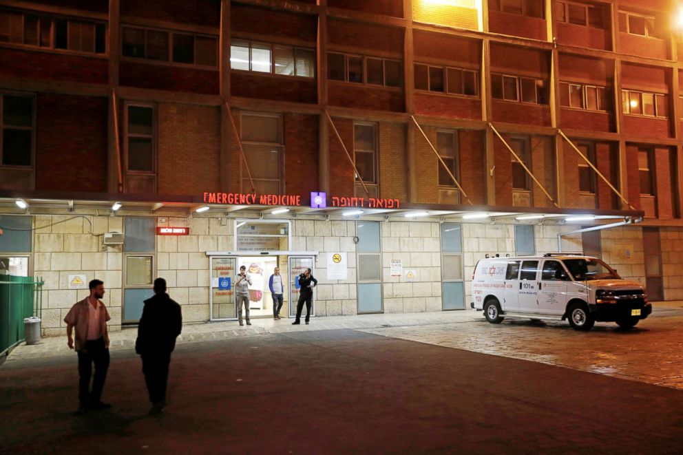 PHOTO: People stand in front of the entrance to the emergency room at the Hadassah Ein Kerem hospital in Jerusalem, March 27, 2018. 