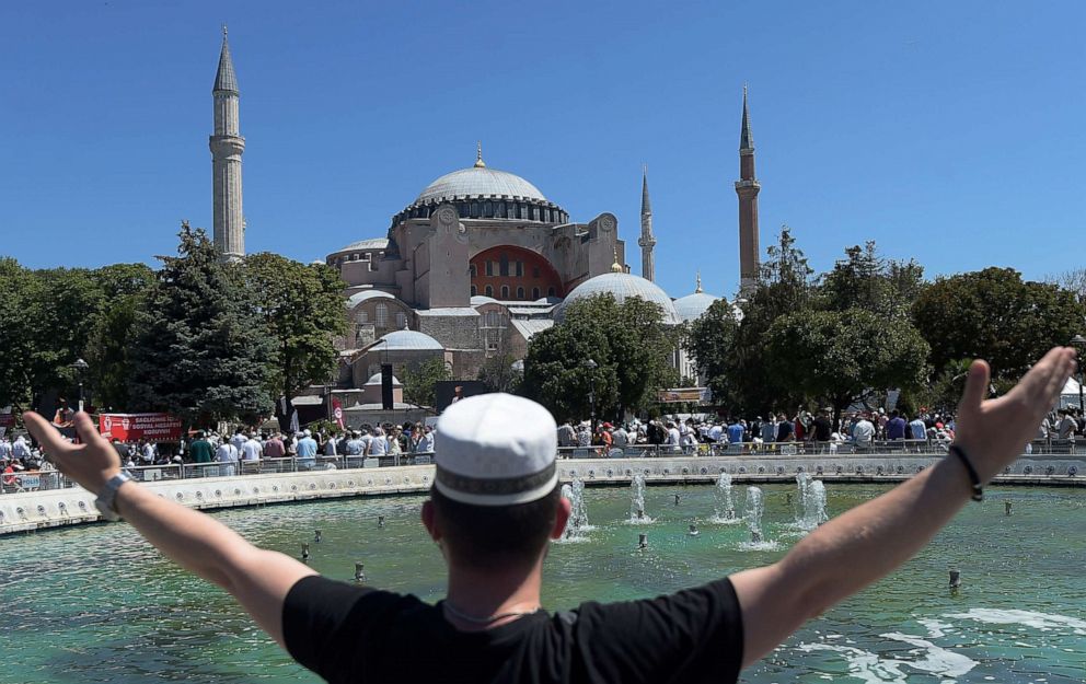 PHOTO: A young man gestures as he waits in the historic Sultanahmet district of Istanbul, outside the Byzantine-era Hagia Sophia, July 24, 2020, in Istanbul.
