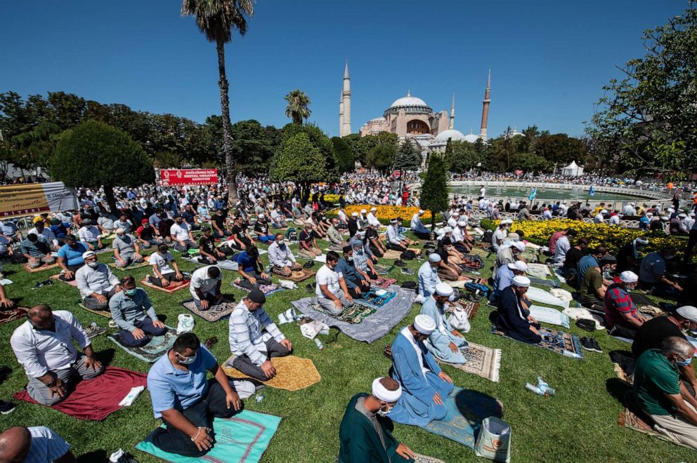 PHOTO: Thousands of people pray during the first official Friday prayers outside Hagia Sophia Mosque on July 24, 2020, in Istanbul.