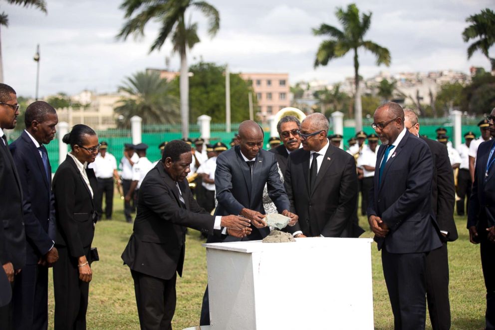 PHOTO: Haiti's President Jovenel Moise, center, places the first stone for the construction of a new National Palace on the 8th anniversary of the 2010 earthquake, in Port-au-Prince, Haiti, Jan. 12, 2018. 
