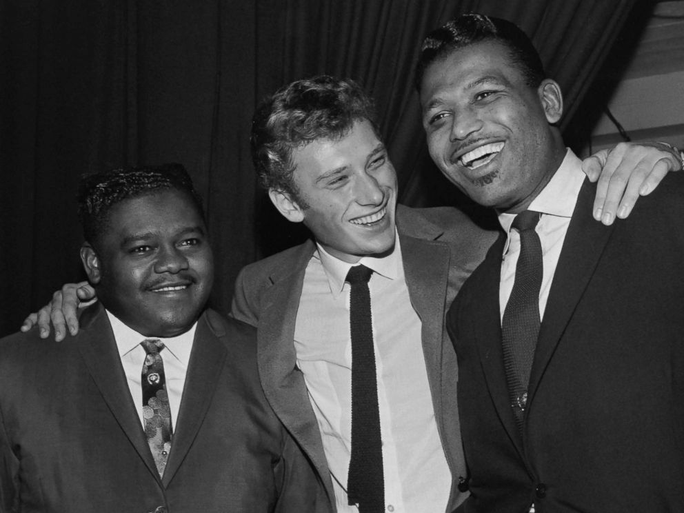 PHOTO: Fats Domino (L) being congratulated by French singer Johnny Hallyday (C) and US boxing champion Ray Sugar Robinson following his performance at the Palais des Sports in Paris, Oct. 20, 1962.
