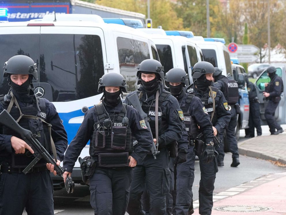 PHOTO: Policemen walk through a street close to the site of a shooting in Halle an der Saale, eastern Germany, on October 9, 2019.