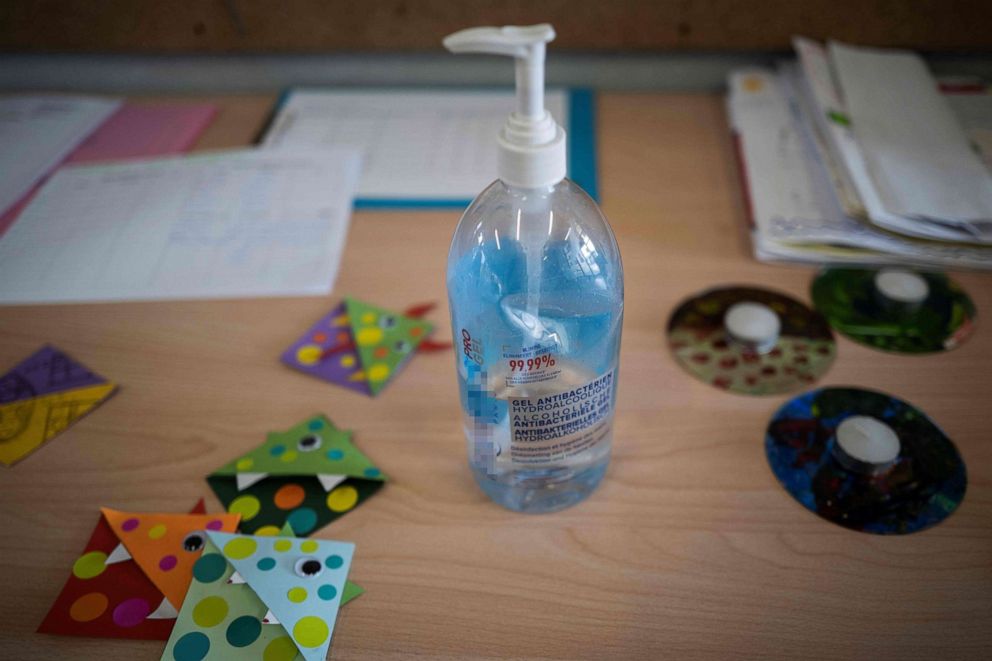 PHOTO: Hand sanitizer is seen on a desk where children whose parent are either a nurse or a police officer attend the Borderouge elementary school used as a daycare center during the Easter holiday, in Toulouse, southern France, on April 16, 2020.