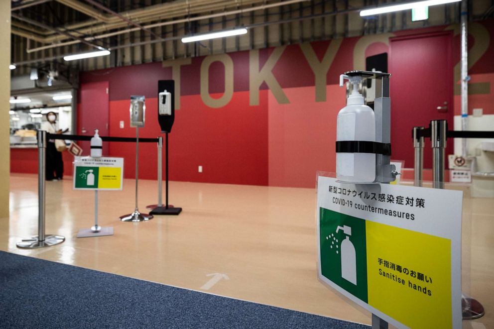 PHOTO: Hand sanitizer stations are seen at the entrance to the casual dining hall of the Tokyo 2020 Olympic and Paralympic Village in Tokyo, Japan, during a media tour on June 20, 2021.