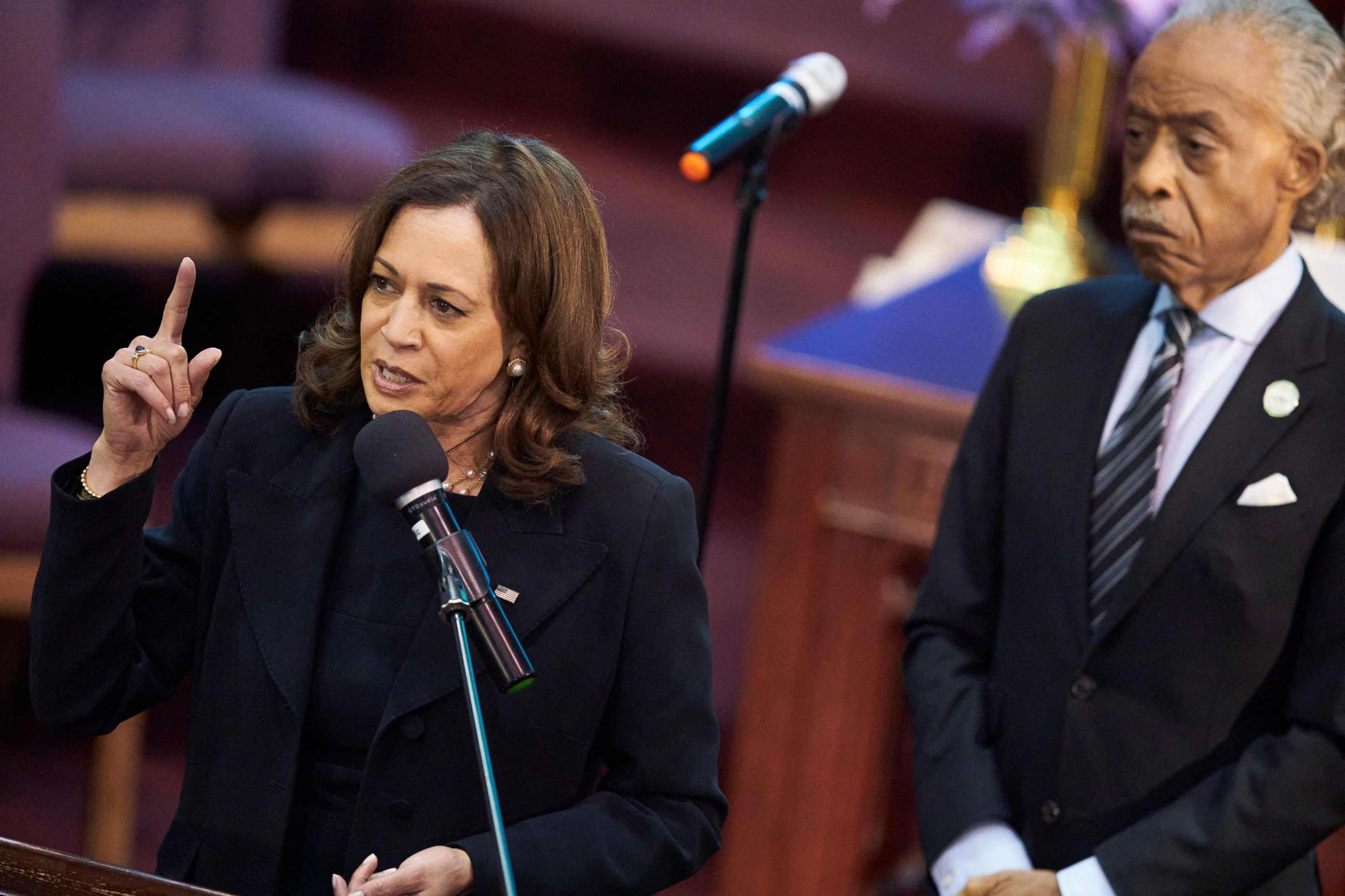 PHOTO: Vice President Kamala Harris, with the Reverend Al Sharpton at right, speaks at the funeral service for Ruth Whitfield in Mount Olive Baptist Church in Buffalo, New York, on May 28, 2022.