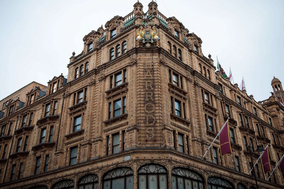 PHOTO: The Harrods name is illuminated in lights on the front of the department store in Knightsbridge on Nov. 29, 2017, in London.