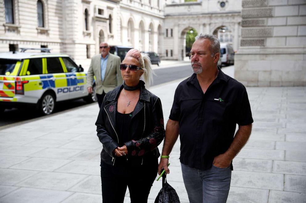 PHOTO: Charlotte Charles, mother of Harry Dunn, and Dunn's stepfather Bruce Charles walk outside the Foreign and Commonwealth Office in London, July 21, 2020.