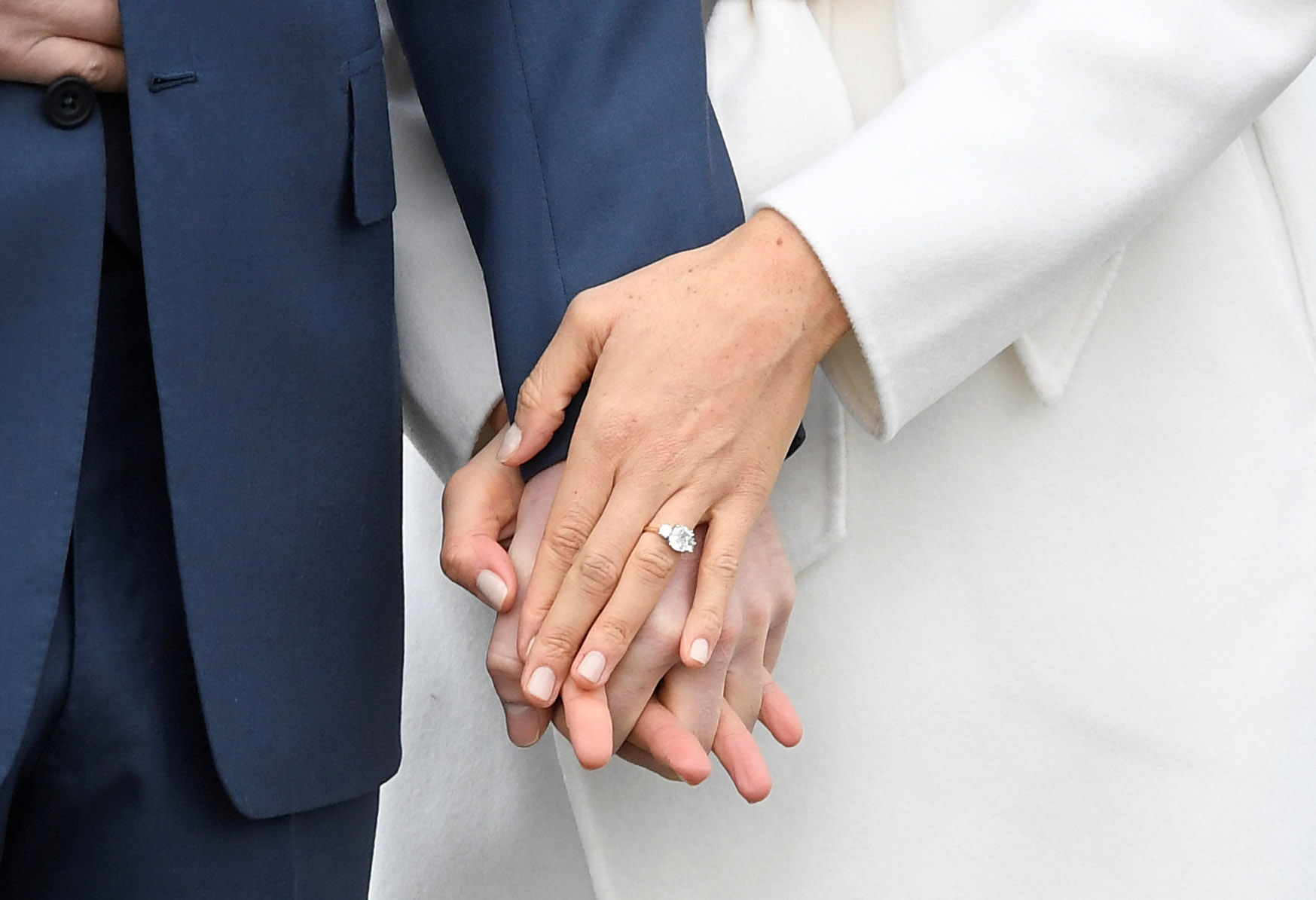 PHOTO: Britain's Prince Harry holds hands with Meghan Marklem wearing an engagement ring in the Sunken Garden of Kensington Palace, London, Nov. 27, 2017. 