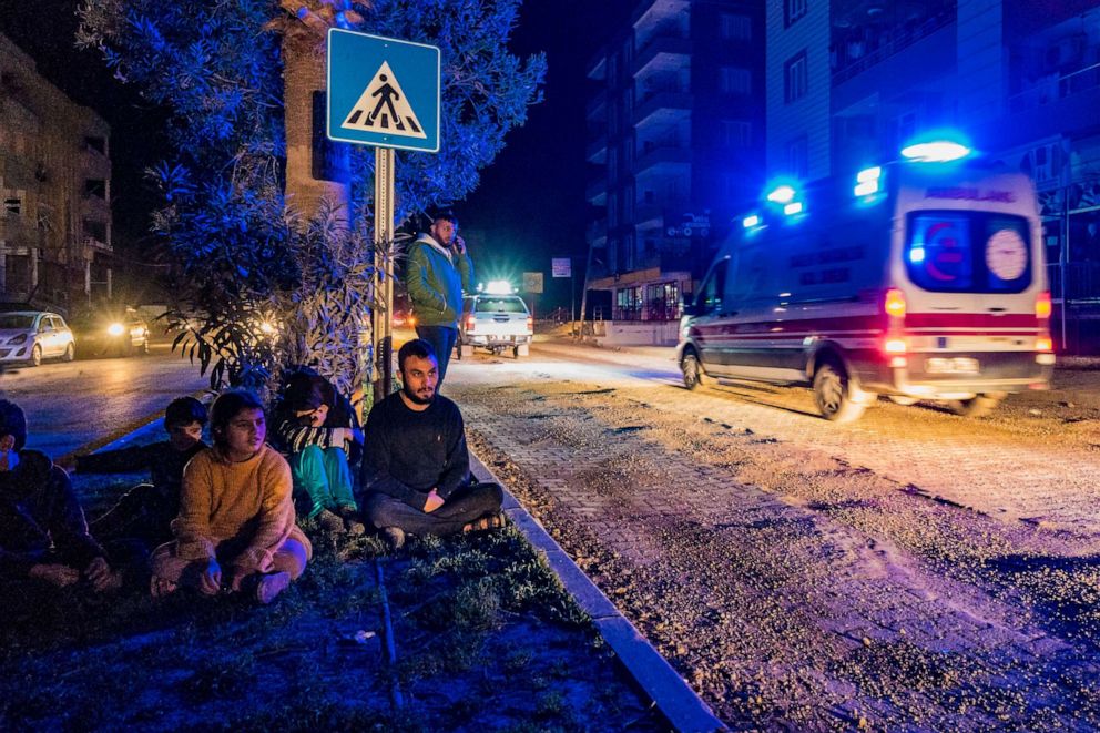 PHOTO: Civilians wait in the middle of the streets after a fast evacuation of their homes because a 6,4 magnitude earthquake in Reyhanli, Hatay, near the border with Syria in Turkey, Feb. 20, 2023.