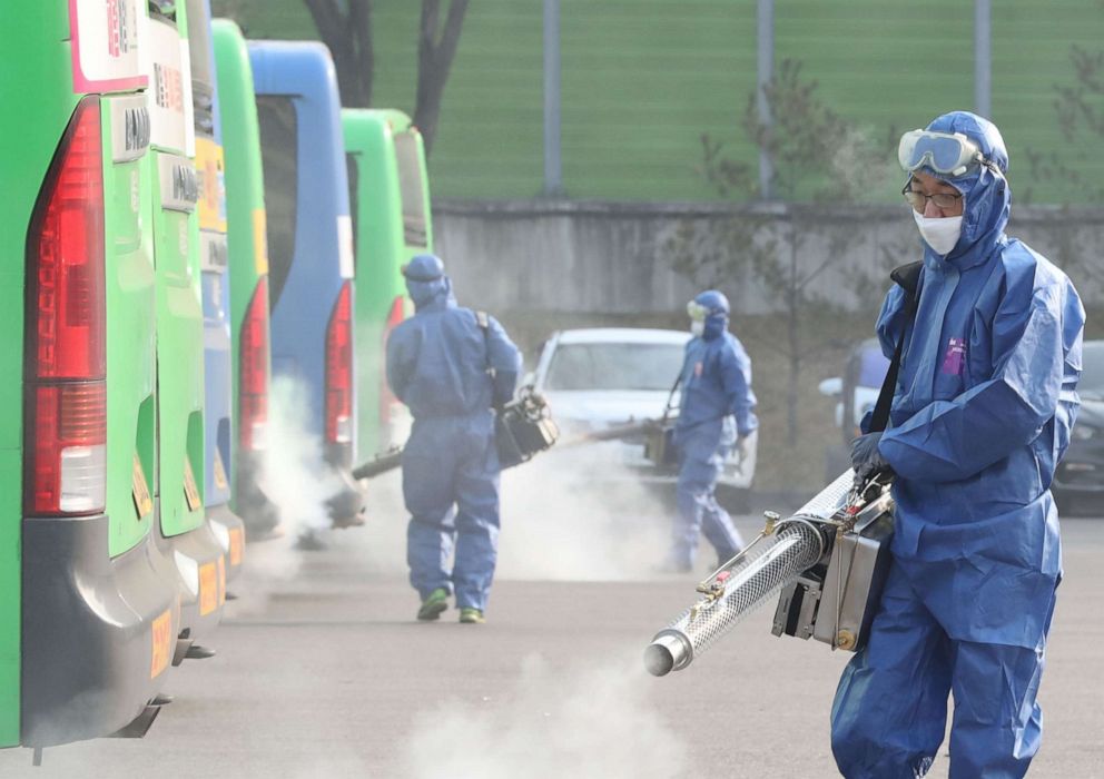 PHOTO: Workers from a disinfection service spray disinfectant, as part of preventive measures against the spread of the novel coronavirus, at a public bus terminal in Seoul, South Korea, on Feb. 20, 2020.