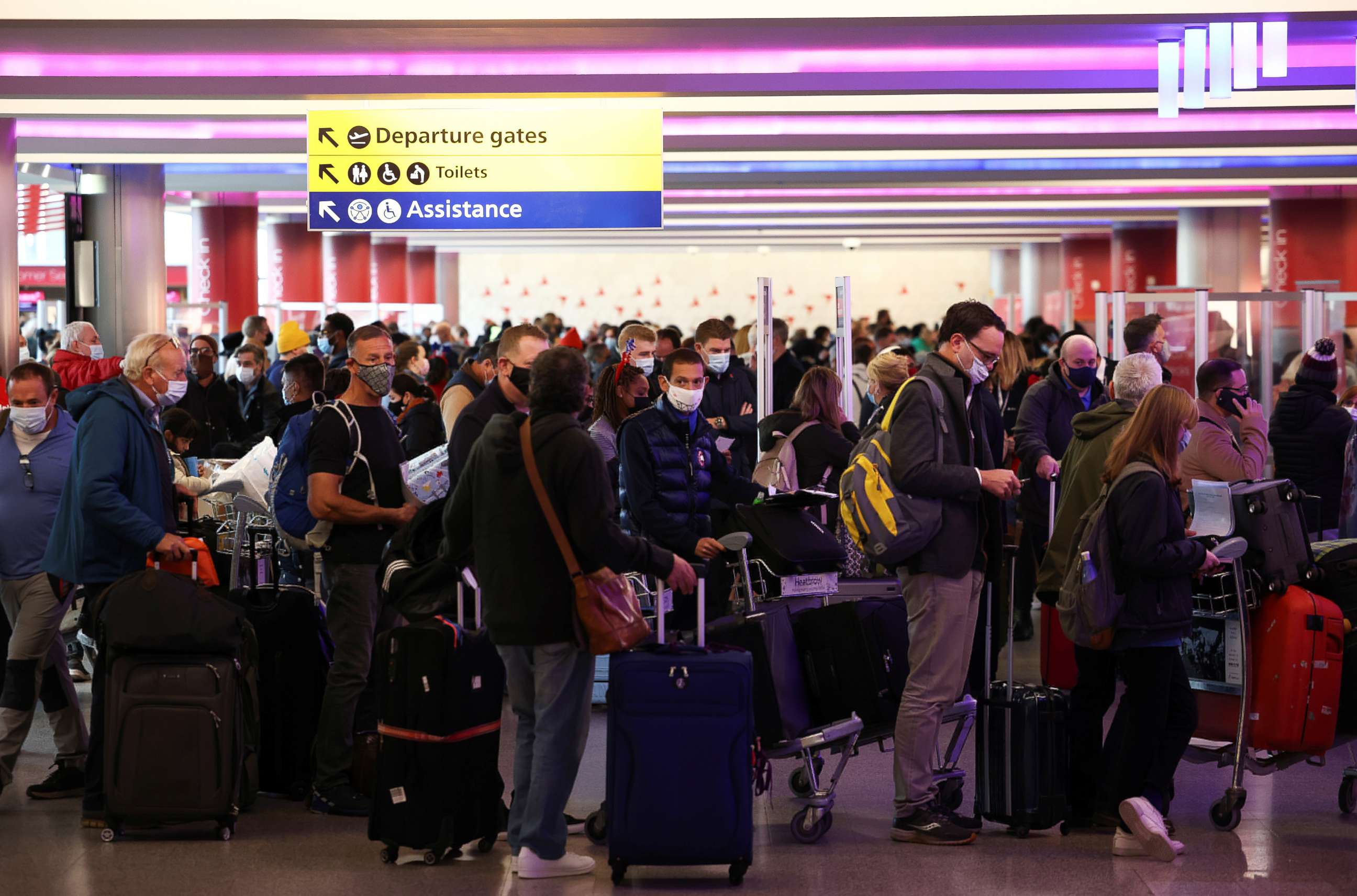 PHOTO: People queue to check into Virgin Atlantic and Delta Air Lines flights at Heathrow Airport Terminal 3, following the lifting of restrictions on the entry of non-U.S. citizens to the U.S., in  London, Nov. 8, 2021.