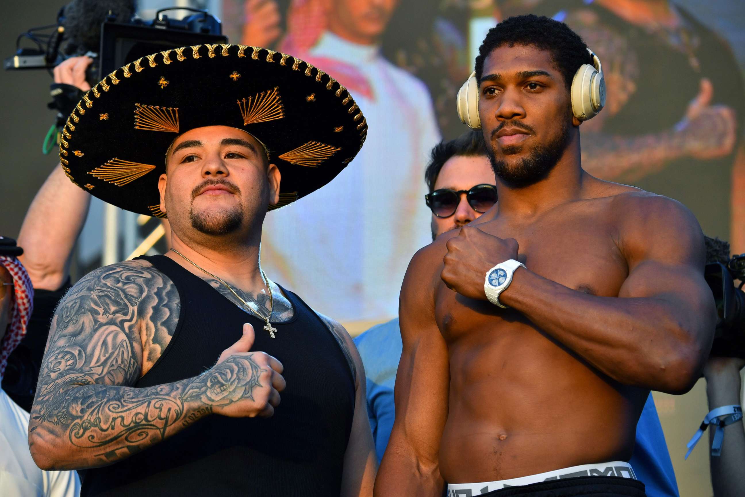 PHOTO: Mexican-American heavyweight boxing champion Andy Ruiz Jr (L) and British heavyweight boxing challenger Anthony Joshua pose during the official weigh-in at Diriyah in the Saudi capital Riyadh.