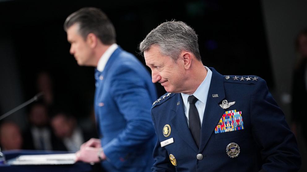 PHOTO: Secretary of War Pete Hegseth and Chairman of the Joint Chiefs of Staff Air Force General Dan Caine arrive for a press briefing at the Pentagon, April 8, 2026 in Arlington, Virginia.