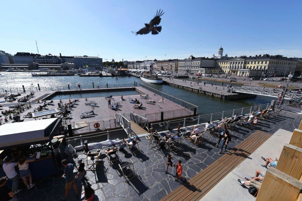 PHOTO: A view of the seafront, Allas Sea Pool oasis, in the foreground, the Market Square, and the Presidential palace, in Helsinki, Finland, June 28, 2018.