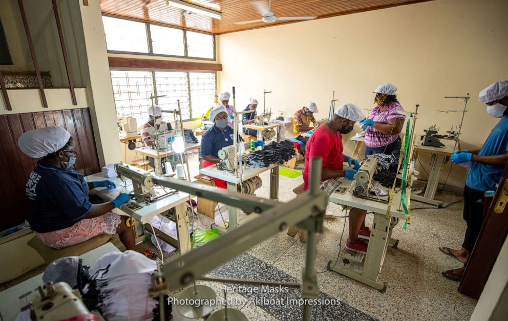 PHOTO: Workers produce face masks for Heritage Masks, approved by Ghana’s Food and Drug Authority to help protect against the novel coronavirus, in a factory in Accra, Ghana, in May 2020.