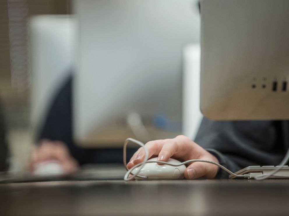 PHOTO: Close up of student using computer mouse in classroom in this undated stock photo.